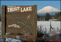 Welcome to Trout Lake, photo of welcome sign and Mount Adams in the background