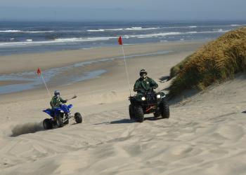 Forest Service Employees on OHVs on sandy dunes