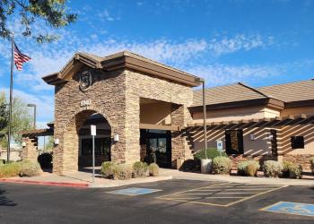 Front view of the Mesa Ranger Station building with a clear sky in the background.