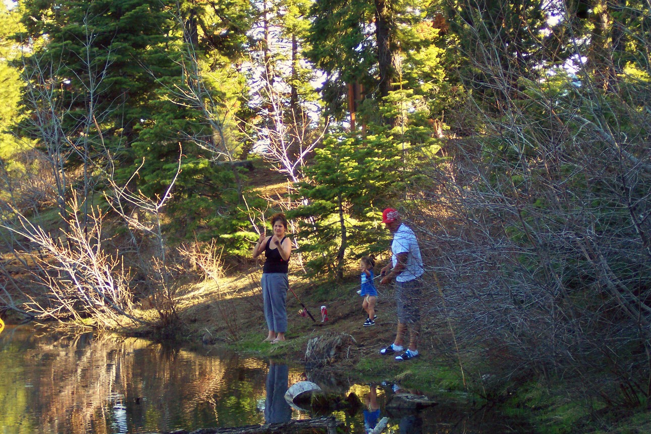 A family fishing on the banks of Stough Reservoir