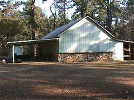 Photo of a building with a carport.