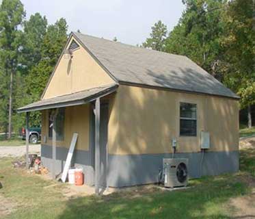 Photo of an older single room building.