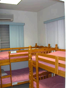 Photo of two sets of bunk beds in the same room.