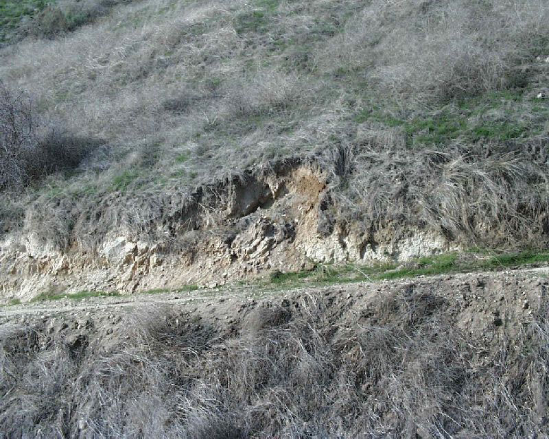 Slumping backslope failure.