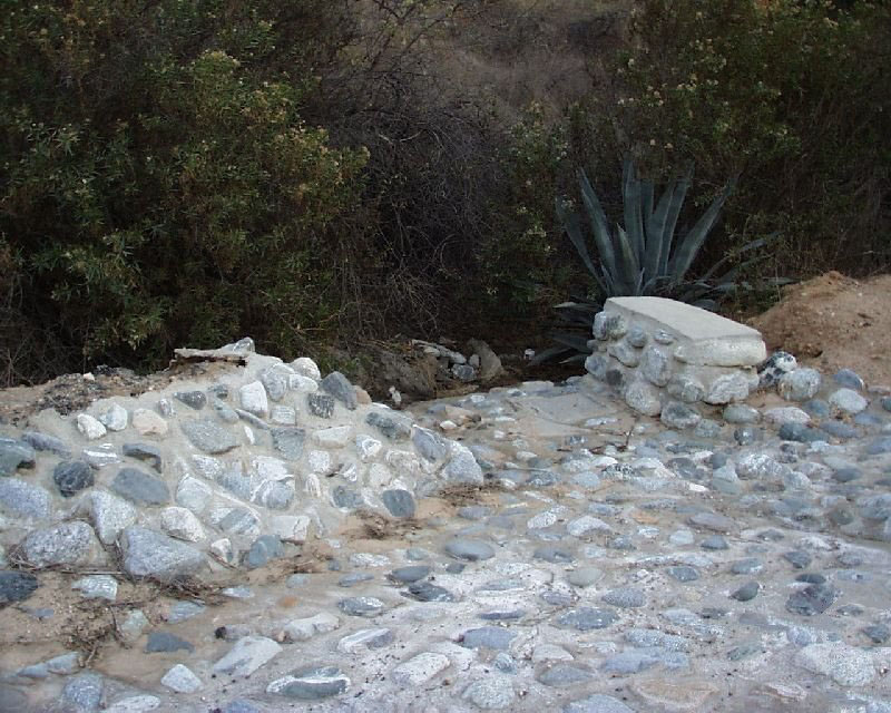 Grouted rock lead out ditch resists erosion.