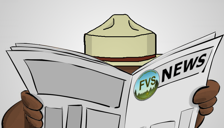 Smokey Bear behind a newspaper with an FVS logo and News on its banner.