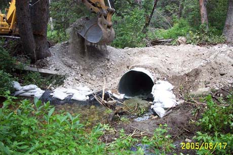 Photograph: Installation of temporary crossing using heavy machinery with <br> sand bags on the Wasatch-Cache-Unita NF, Utah. Photograph provided by Charlie Condrat.