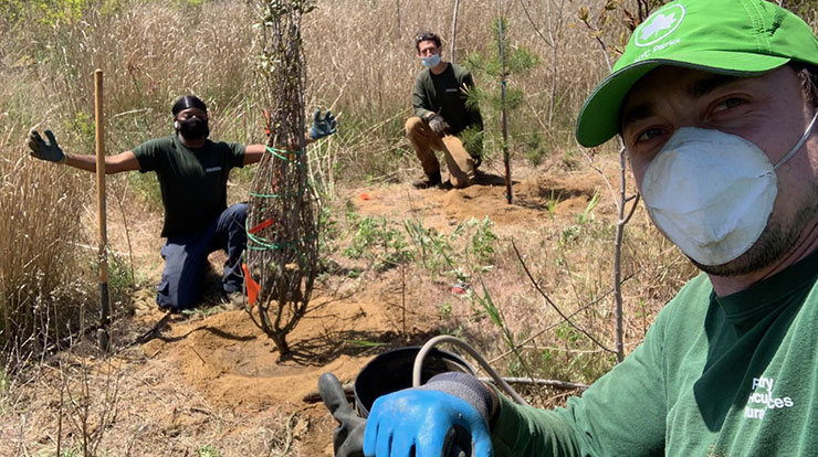 NYC Parks Idlewild Field Crew: Piotr Bartoszewski, Raykwon Pritchett, Wes Markusfeld planting shrubs and trees in Idlewild Park, Queens, New York.