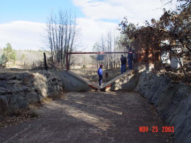 Students from NAU's School of Forestry are visiting the Watershed 12 gaging station during a field-trip for a Hydrology Course