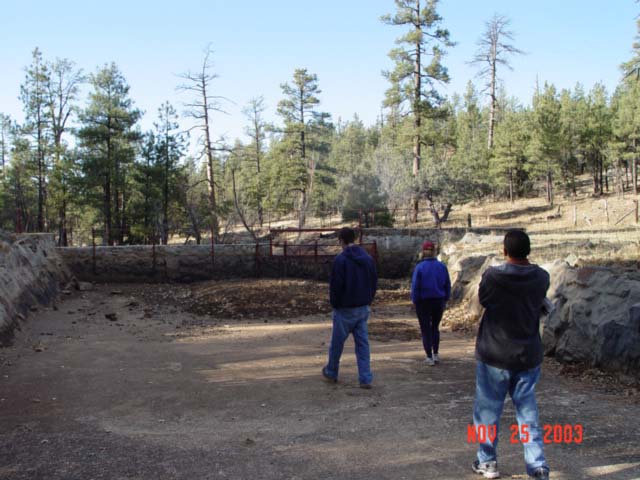 Students from NAU's School of Forestry are inspecting Watershed 12's research structures during a field-trip for a Hydrology Course.