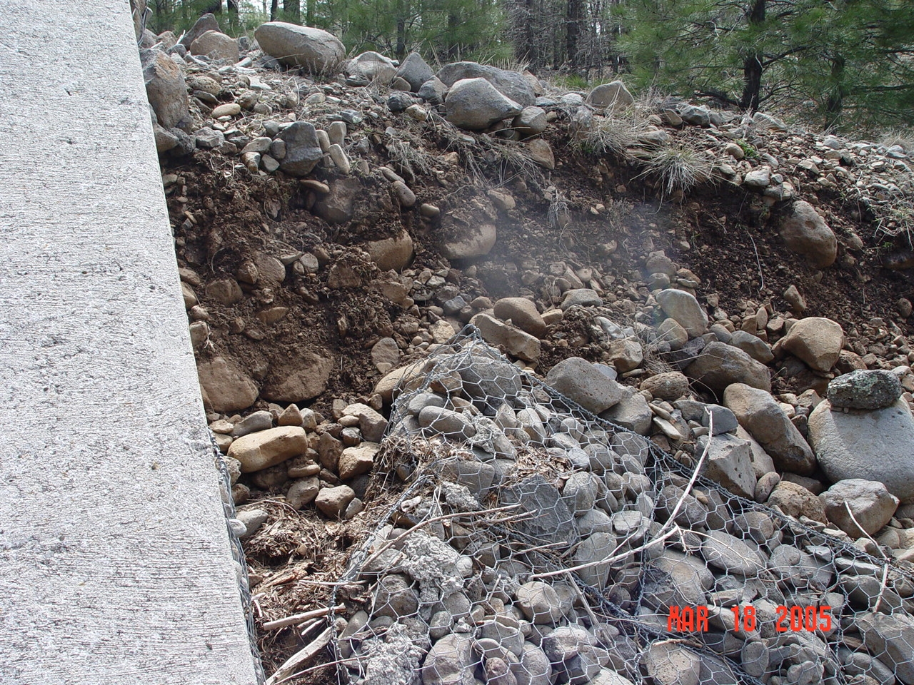 A more detail picture of the collapsed sidewall of the Bar M stilling pond that was damaged in high flow events in the winter of 2004/2005.