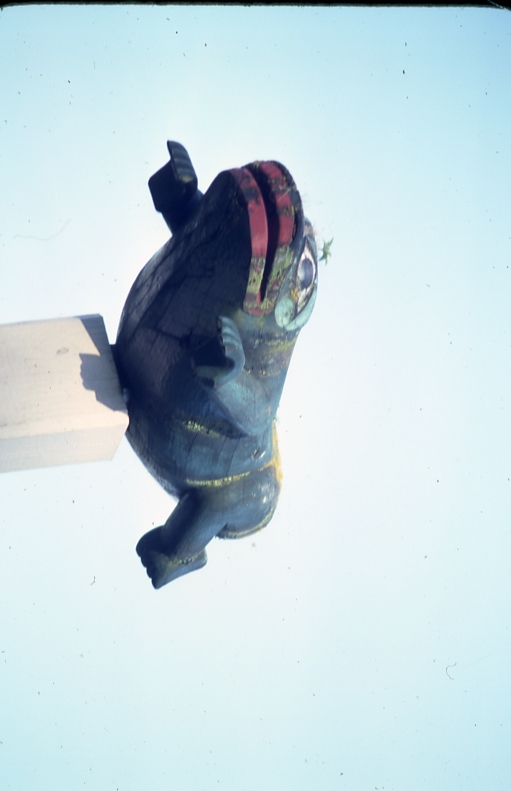 Figure on top of totem