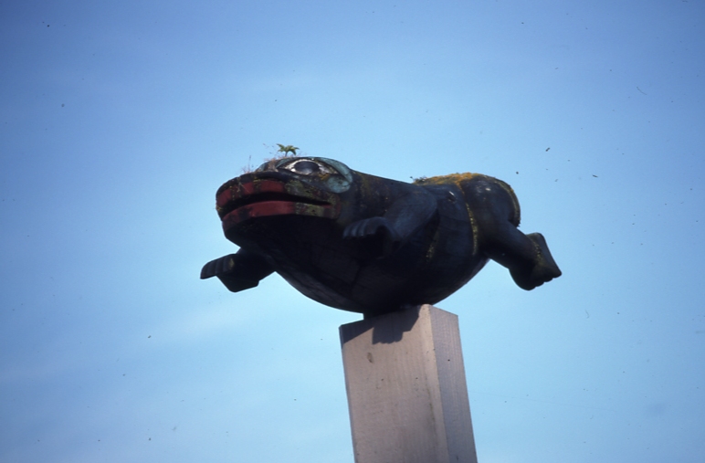 Figure on top of totem