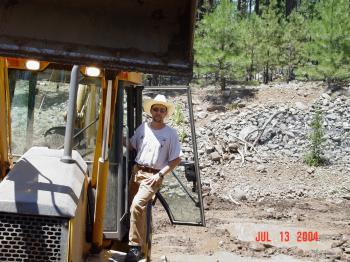 Heavy machinery is used to repair damage to the Bar M stilling pond.