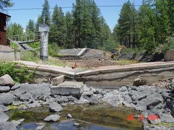 Heavy machinery is used to repair damage to the Bar M stilling pond.