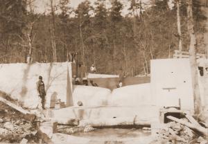 Caption reads:  "A modified Columbus deep-notch weir and approach basis under construction on West Nesbitt Creek."