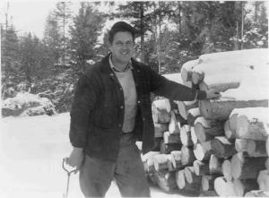 Bernard L. Baker using wrist guard while handling pulpwood in MU4 in March 1952 (photo 2 of 2)