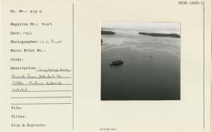 Log barge being towed from Yakutat to Sitka. Picture taken @ Yakutat.