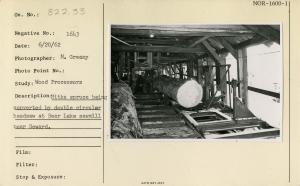 Sitka spruce being converted by double circular headsaw at Bear Lake sawmill near Seward.