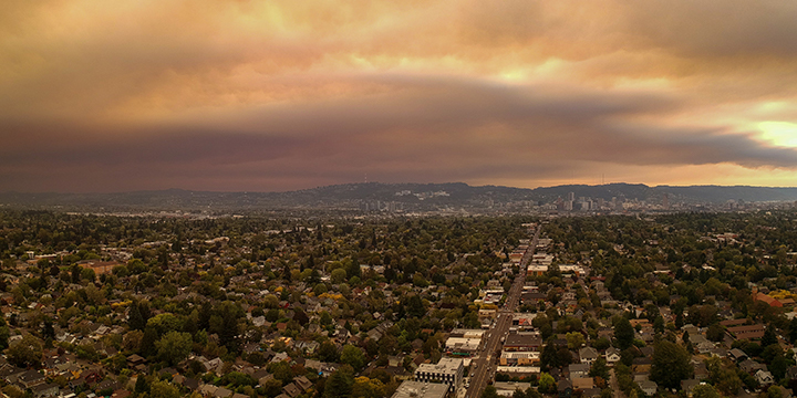 A picture of Portland, Oregon with smoke-filled air in the sky above the city.