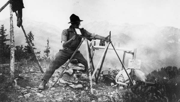 Photo: Archival photo of Harry T. Gisborne, first full-time fire researcher in the Forest Service, surveying a forest