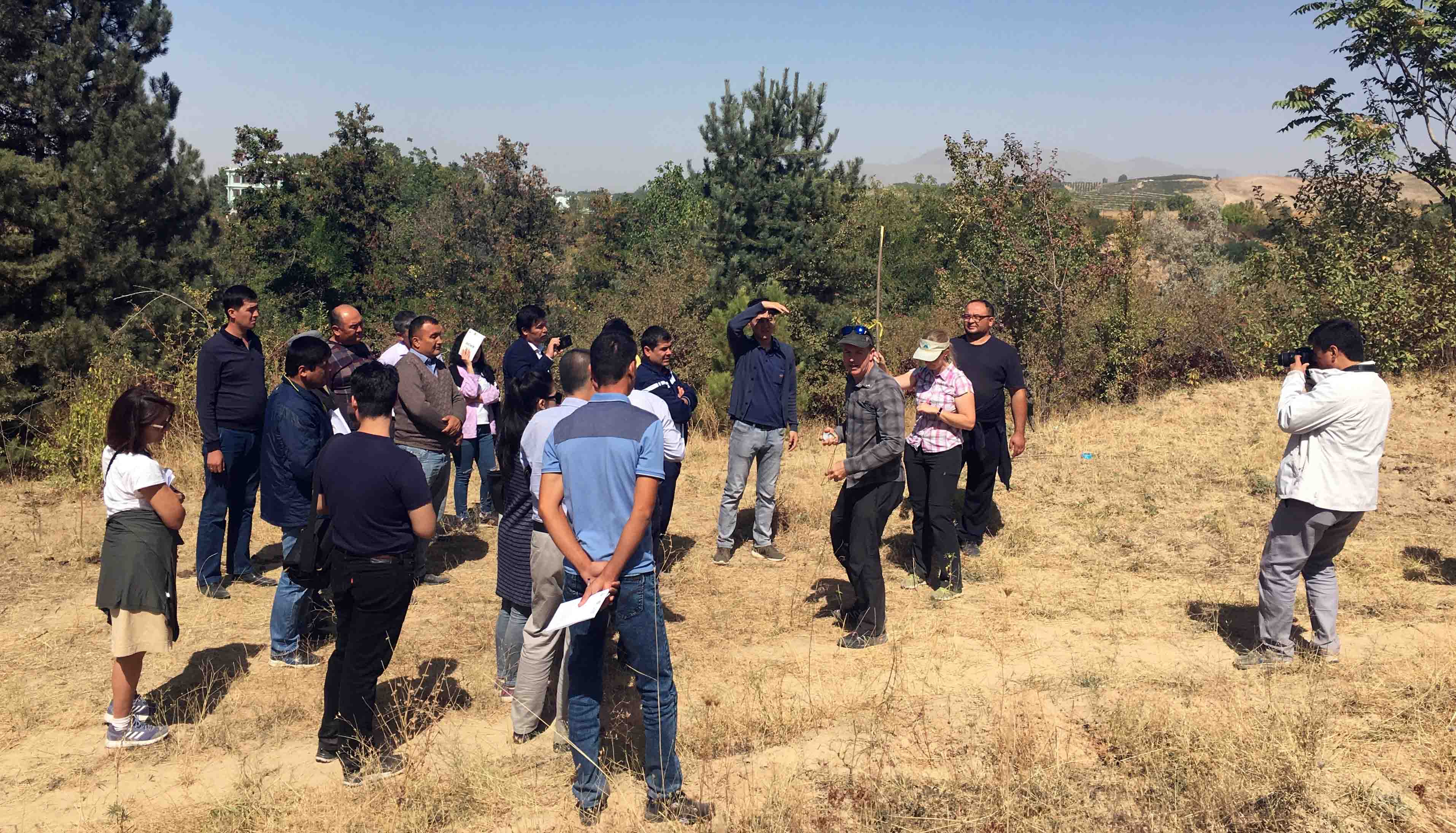 Forest Service specialists and workshop participants in a field.