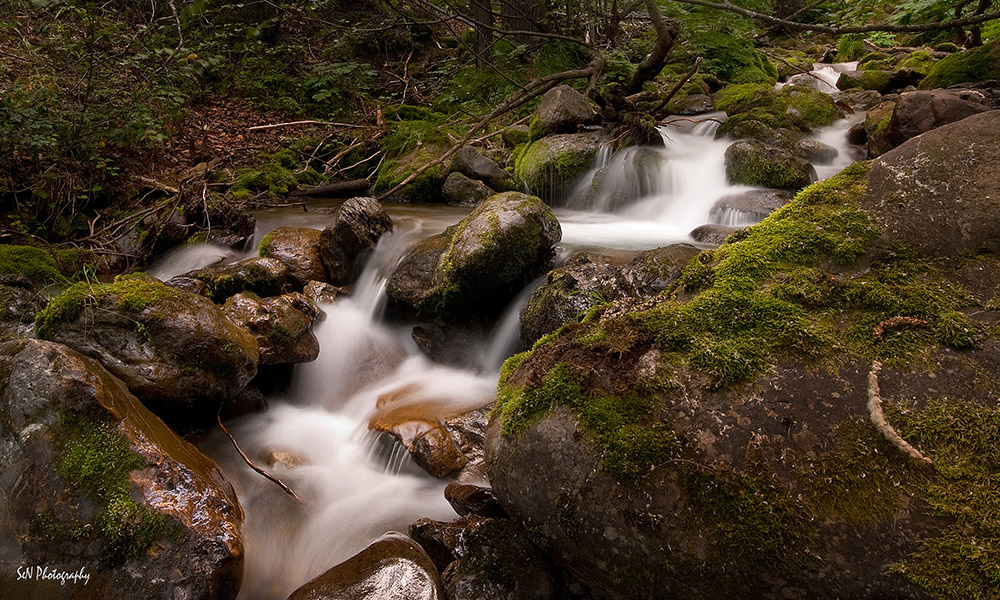 A photo of a stream waterfall