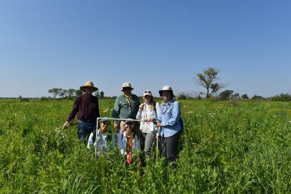 Goup photo: six women posing in Midewin NAtional Tallgrass