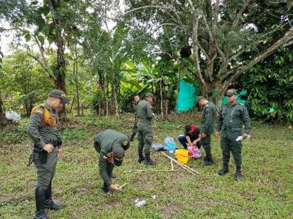 Group of uniformed mean out in a field