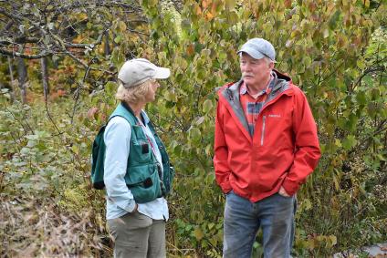 Forester talks to local resident.
