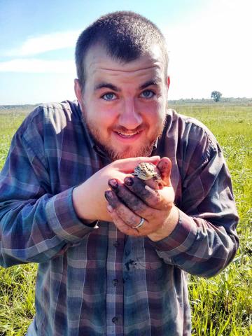 man holding frog