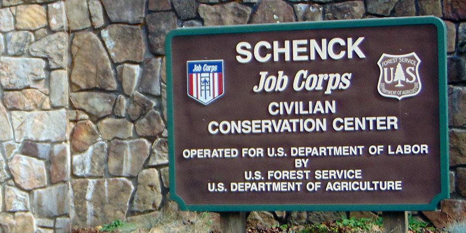 Schenck Job Corps sign and rock wall at entrace to facility.