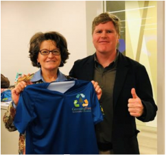National Fire Director Shawna Legarza receives Greening Fire Team T-Shirt in appreciation for her support. 