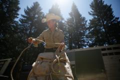 Katy Bartzokis tightens up a parcel that she will soon take into the Trinity Alps Wilderness to resupply a back country trails crew. 