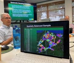 Close-up of computer screen. Caption: Spatially balanced sample. Below a map and numbers.