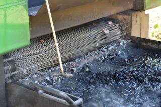 Close-up of mobile biochar unit output.