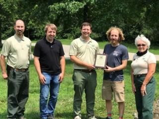From left, Tray Hall, district recreation officer, Mark Twain NF, Andy Schuette, COMO Trail Association, Tony Crump, deputy forest supervisor, MTNF, Nate Smith, COMO Trail Association, and Jane Mobley, forest/manpower development specialist, MTNF. USDA Forest Service.