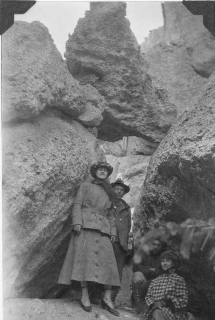 A historical photo of four climbers at climbers taking a break for a photo at the Wheeler National Monument.