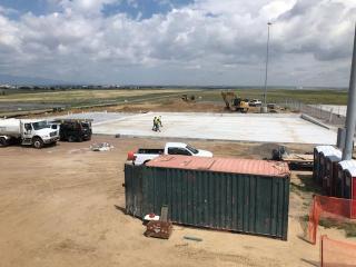Construction site: cement foundation layed on the ground