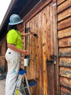 A worker restores historic structure