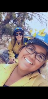 Trapper Creek Job Corps graduate Maite Olsen (center) snaps a selfie while working out in the field. 