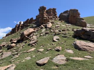 Image of an example of differential erosion with stacked rocks.
