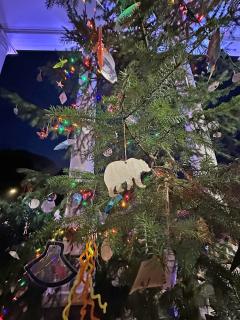 A christmas tree with handmade ornaments