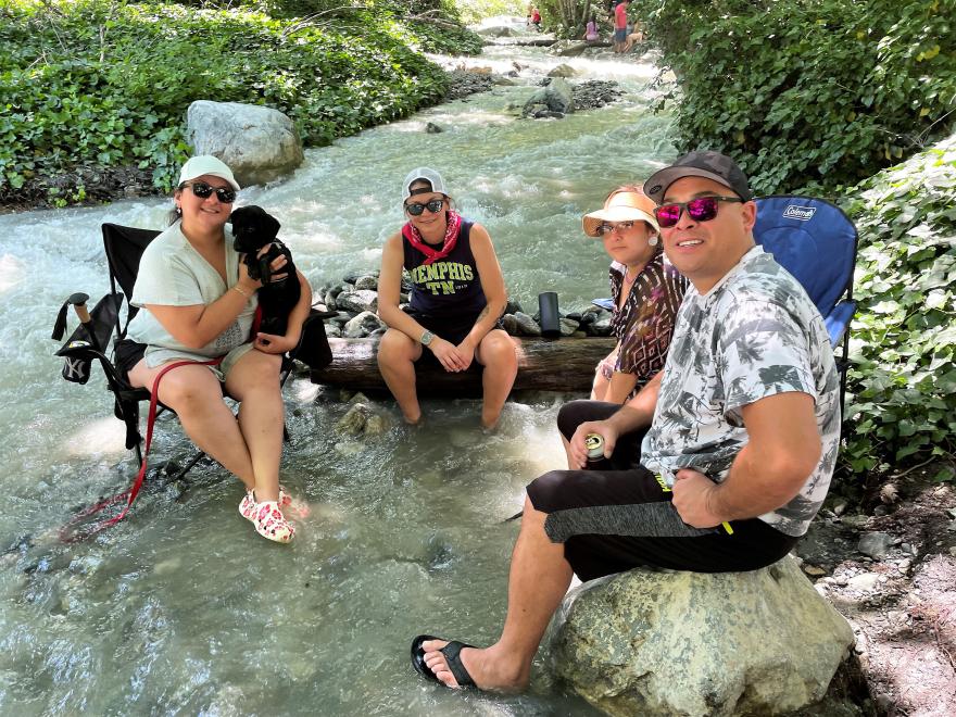The Gonzalez and Juaregui families cool their feet in Lytle Creek. USDA Forest Service photo by Gus Bahena.