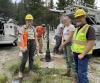 Forest Service Engineers surrounding a recently completed amenity at the forest