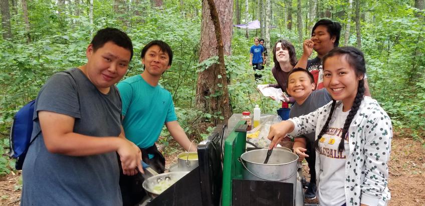 Youths from the Urban Roots Minesota group enjoying and picnic outdoors