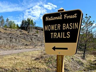 A sign marking the Mower Basin Trails.jpg A sign marking the Mower Basin Trails.