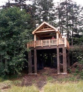 A wooden observation deck in the forest.