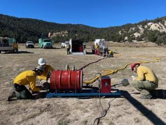 Crew inspects and preps helitorch equipment