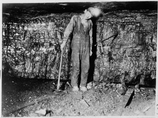 historic photo of a miner in front of a coal seam.jpg historic photo of a miner in front of a coal seam